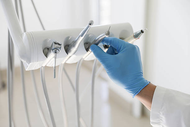 Professional Tooth Extraction technician working in Russell County County, VA